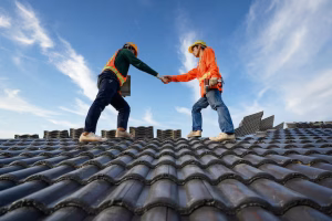 asian-male-roof-repairman-work-together-as-team-standing-roof-ceramic-cement-roof-tiles-construction-site_140555-1228